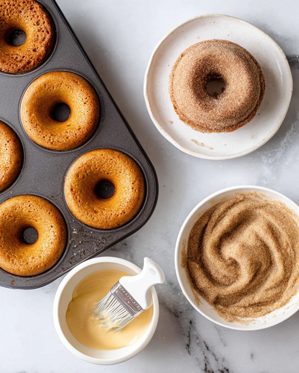 Six donuts with a light brown base are arranged in two rows of three on a black wire cooling rack. Each donut is covered with a thick layer of white glaze that smoothly drips down the sides, showing the texture of the donut underneath. The rack rests on a white marbled surface that adds a clean and bright look to the image. The photo is taken from above, showing the round shape and the holes in the center of each donut. photo taken with an iphone --ar 4:5 --v 7