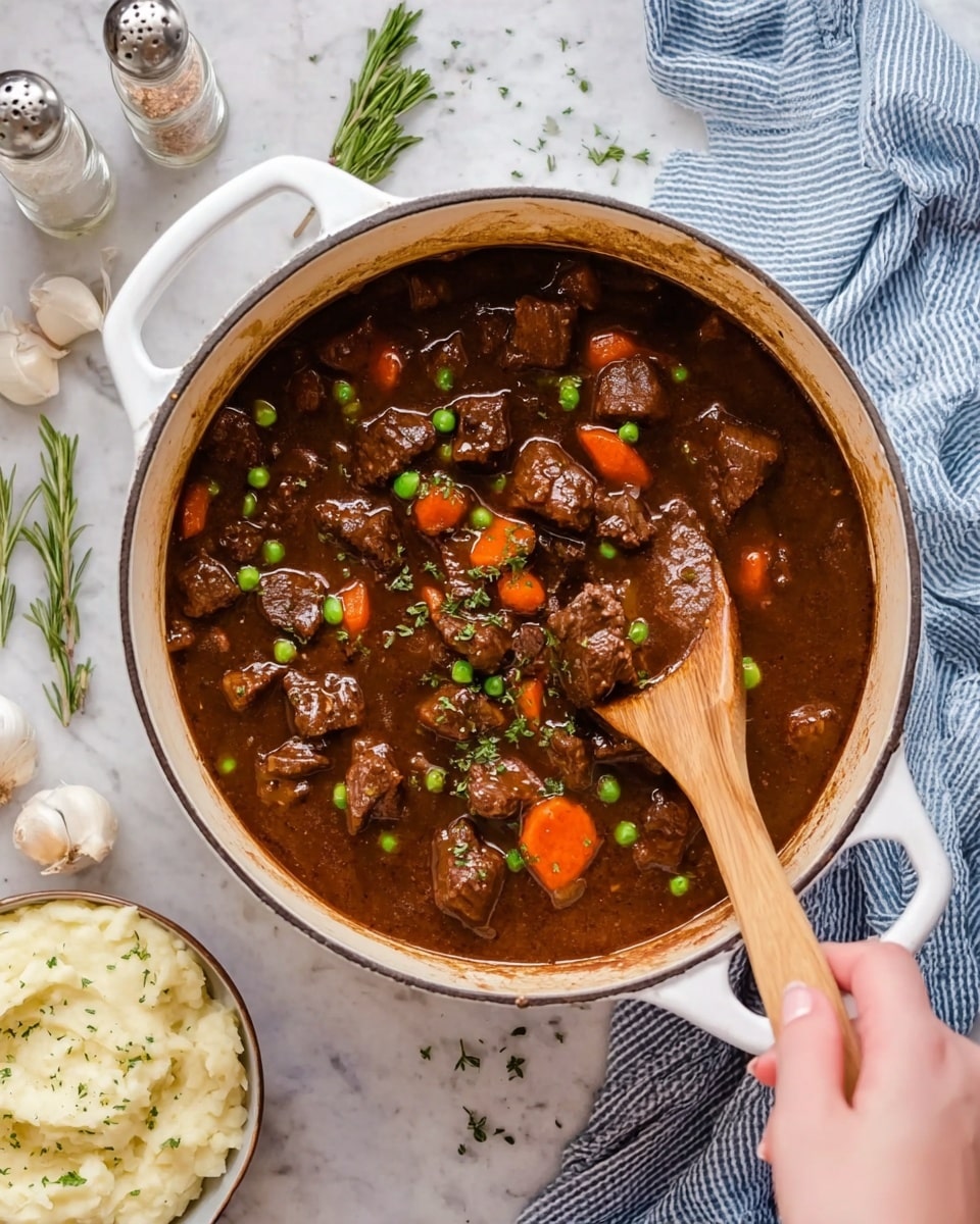 A white pot filled with a thick dark brown stew that has medium-sized chunks of beef, bright orange carrot pieces, and small green peas mixed in. A woman's hand is holding a wooden spoon, lifting some beef and carrots from the stew. The pot is sitting on a white marbled surface with a small bowl of mashed potatoes sprinkled with herbs in the corner below, and salt and pepper shakers, white wine bottle, garlic bulb, and fresh rosemary sprigs placed around the pot. A striped blue and white cloth is near the woman's hand. photo taken with an iphone --ar 4:5 --v 7