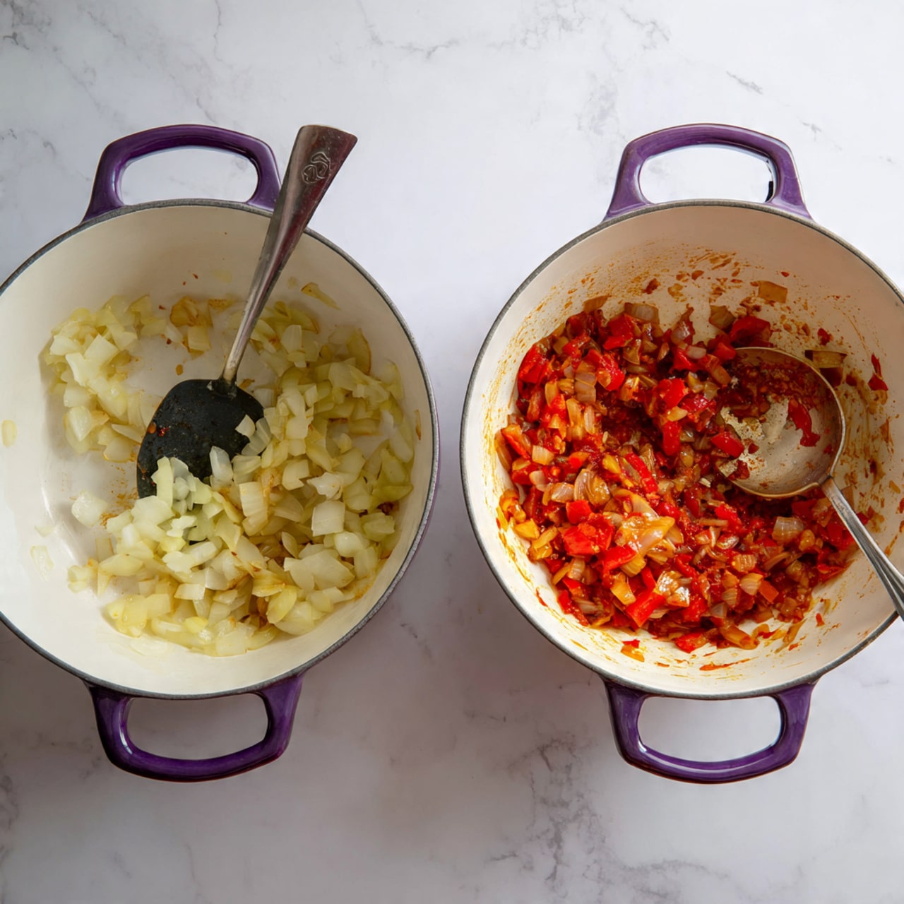 The image shows two white heavy pots with purple handles on a white marbled surface, each with a long spoon resting inside. The left pot holds finely chopped pale yellow onions being cooked, showing a soft, slightly translucent texture. The spoon inside has a black head and metal handle. The right pot contains a mixture of cooked chopped onions and red peppers, with a rich orange-red sauce coating the vegetables. The spoon in the second pot is similar, with some sauce stains on it. Both pots have a clean, smooth inside surface that contrasts with the cooked ingredients. Photo taken with an iphone --ar 4:5 --v 7
