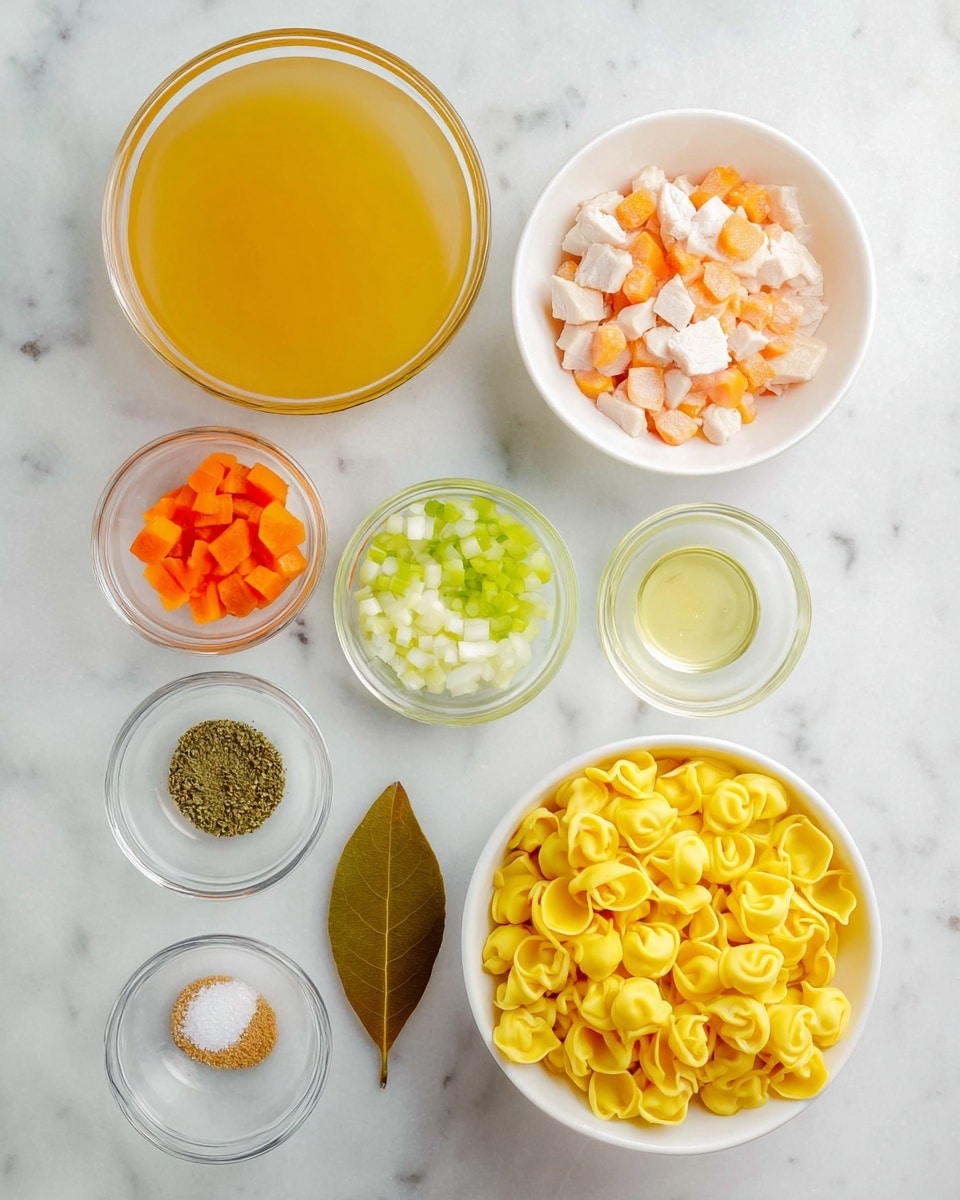 The image shows an overhead view of several small glass and white bowls arranged neatly on a white marbled surface. There is a large bowl of clear golden broth in the top left, a bowl of pale orange diced raw chicken to its right, and a white bowl filled with bright yellow tortellini at the bottom right. Around these larger bowls are smaller glass bowls holding minced garlic, dried spices, diced celery, chopped carrots, diced white onion, oil, salt, and pepper. In the center lies a single brown bay leaf, adding a natural touch to the scene. Each ingredient is clearly visible with vivid colors and distinct textures. Photo taken with an iphone --ar 4:5 --v 7