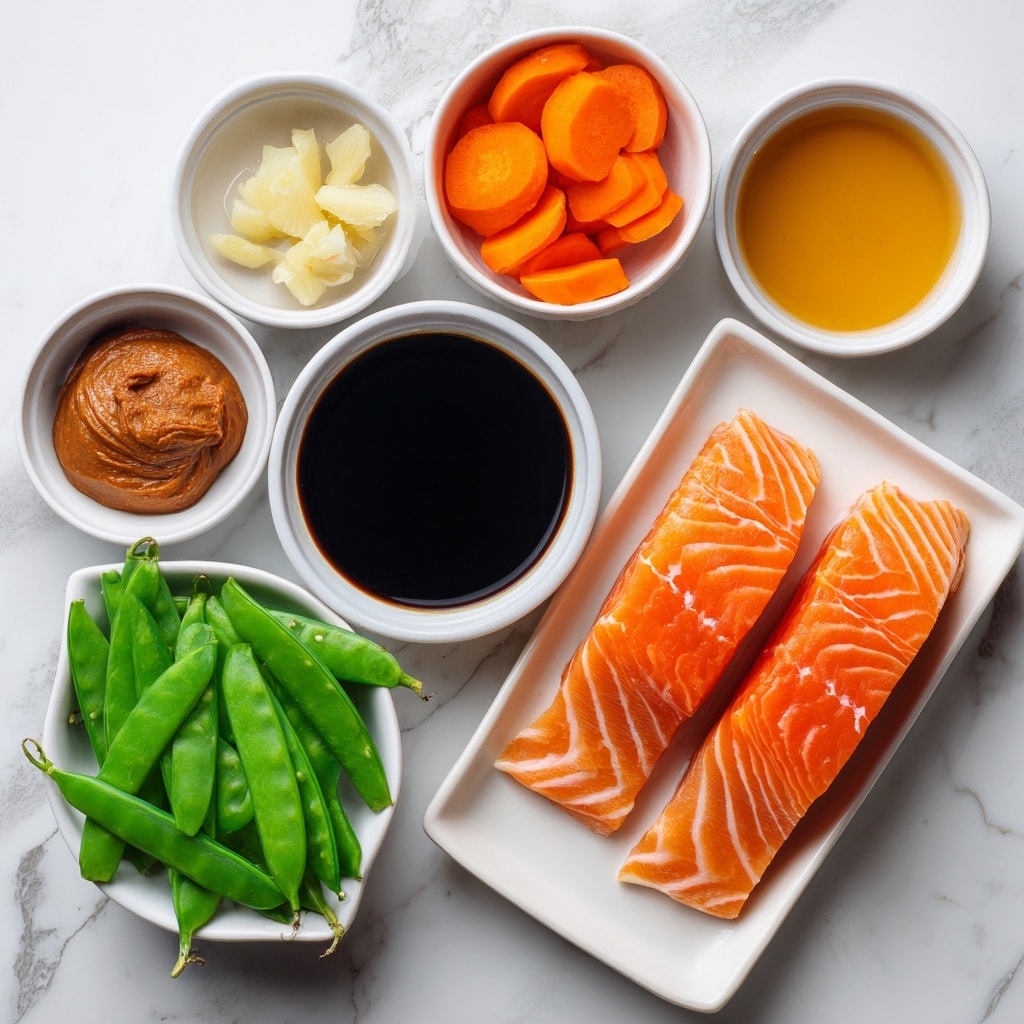 This image features a white marbled background with eight small white bowls arranged in a loose circle and one white rectangular tray at the bottom right. The tray holds two fresh salmon filets, bright orange with pale white lines, side by side. The bowls contain different ingredients: on the top left is thick dark orange miso paste, below it are bright orange carrot slices, and below those are fresh green snow peas with smooth, shiny surfaces. At the center is a bowl of dark soy sauce, shining black and smooth. To the top right of the soy sauce are minced garlic and ginger placed side by side in a small white bowl; the garlic is pale yellow and the ginger is a light tan shade. Next to it is a bowl of shiny golden-yellow mirin. The layout is clean and simple, showing each ingredient clearly on the white marbled background with clear text labels indicating their names. Photo taken with an iphone --ar 4:5 --v 7