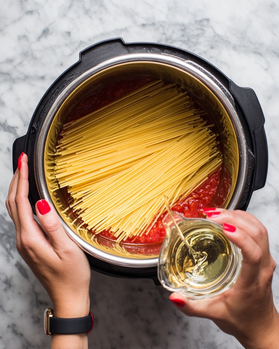 The image shows a pot filled with spaghetti mixed with a thick red sauce that has chunks of cooked ground meat evenly spread throughout. The spaghetti noodles are long and coated in the rich tomato-based sauce, with some strands curving naturally. On top, there is a light sprinkling of finely grated white cheese melted slightly into the sauce. The pot has a shiny metallic inside and a black outer edge. The background surface is a white marbled texture photo taken with an iphone --ar 4:5 --v 7