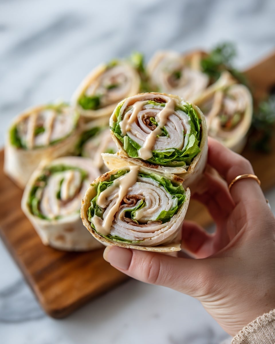 The image shows a close-up of several rolled wraps placed on a wooden board. Each wrap has four visible layers starting with a light brown tortilla on the outside, followed by a thick layer of pale yellow cheese inside. Next, there are thin slices of light pink turkey meat folded neatly, and scattered along with fresh green lettuce leaves. The wrap is held together with toothpicks standing upright in each piece. The background has a soft focus with more wraps visible. photo taken with an iphone --ar 4:5 --v 7