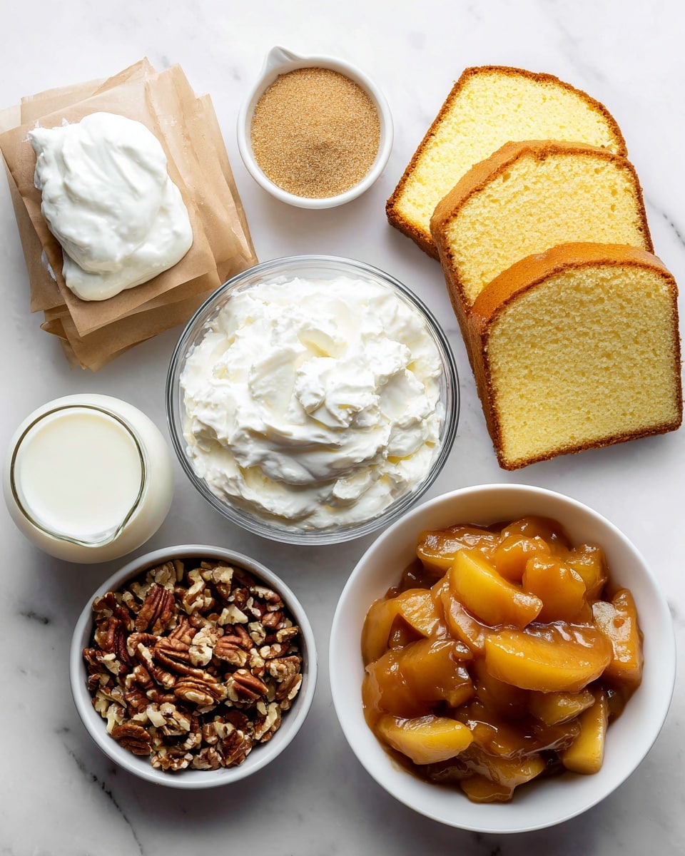 The image shows all the ingredients for a dessert arranged on a white marbled surface. There is a whole classic pound cake with a light golden brown crust and soft yellow inside, beside a slice of the same cake showing its smooth texture. A bowl of fluffy white whipped topping sits next to a bowl of chopped pecans with a crunchy texture and brown color. A clear glass of white whole milk is placed near a bowl filled with thick apple pie filling, which has a shiny, chunky look with caramel-colored apple slices. Two small brown paper bags contain powdery instant vanilla pudding mix, and a white creamer holds smooth caramel sauce. The arrangement is neat and all items are easy to see. photo taken with an iphone --ar 4:5 --v 7