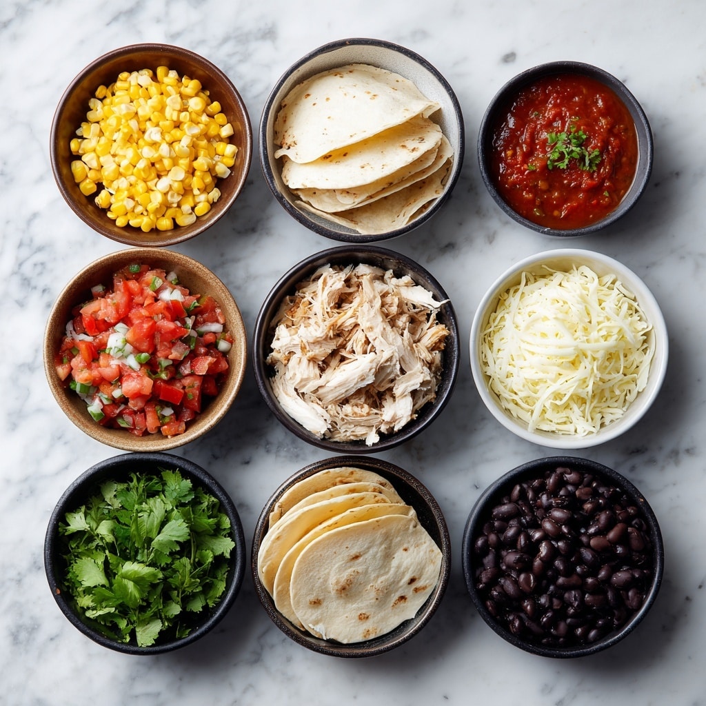 A small white round tostada held by a woman's hand, topped with a layer of shredded light brown chicken, black beans, melted cheese that is creamy white with some brown spots, and scattered bright yellow corn kernels. On top sits a fresh salsa made of bright red diced tomatoes and green cilantro leaves, giving a colorful finish. The tostadas rest on a white marbled surface, with more similar tostadas visible blurred in the background. photo taken with an iphone --ar 4:5 --v 7