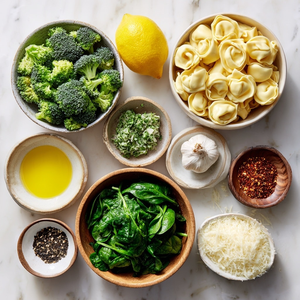 A white bowl filled with two main layers: the bottom layer consists of light yellow folded pasta pieces with ruffled edges, and the top layer holds dark green, slightly charred broccoli florets mixed with wilted spinach leaves. Small white granules of grated cheese are sprinkled over the whole dish. Two bright yellow lemon slices are placed on the right edge of the bowl. The bowl sits on a white marbled surface with a whole yellow lemon and broccoli in the background. Photo taken with an iphone --ar 4:5 --v 7