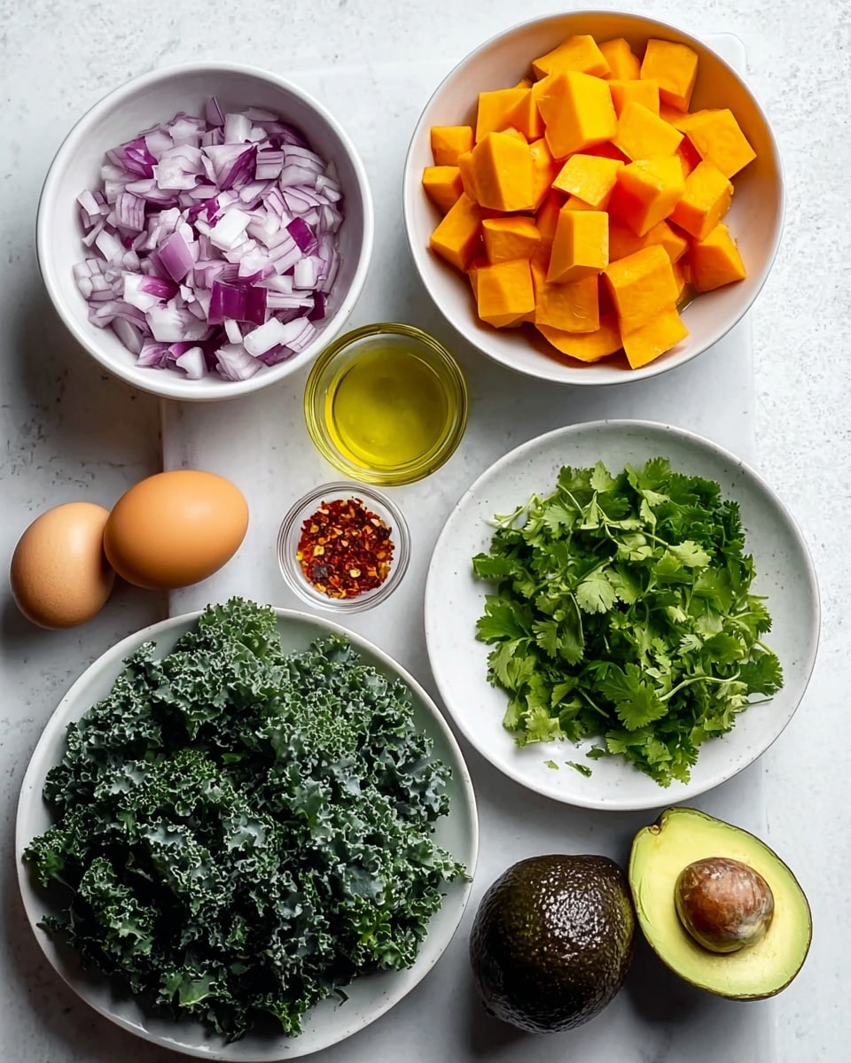 A white plate holds a dish with two main parts: on the left, there are roasted sweet potato cubes mixed with dark green kale pieces, sprinkled with red chili flakes and chopped fresh herbs, creating a textured, colorful pile; on the right, there is a piece of toasted bread spread with chunky, bright green avocado, topped by a sunny-side-up egg with a bright yellow yolk, seasoned with red chili flakes and fresh green herbs. The plate sits on a white marbled surface and a silver fork rests on the left side of the plate. photo taken with an iphone --ar 4:5 --v 7