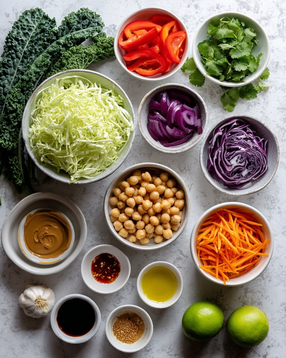 The image shows an arrangement of various fresh ingredients on a white marbled surface. There are vibrant green kale leaves on the top left, next to a white bowl filled with thin pale green shredded cabbage. Below are small white bowls holding bright red bell pepper slices and chopped purple red onion. To the right, fresh green cilantro sits next to small bowls filled with smooth, light brown peanut butter, dark liquid aminos or tamari, and clear water. In the middle, a white bowl is filled with round, beige chickpeas, while another bowl holds thin, bright orange carrot strips. At the bottom, small white bowls contain minced garlic, reddish sriracha, freshly grated yellow ginger, golden maple syrup, and toasted sesame oil. Two whole green limes are placed near the bottom right corner. The photo taken with an iphone --ar 4:5 --v 7