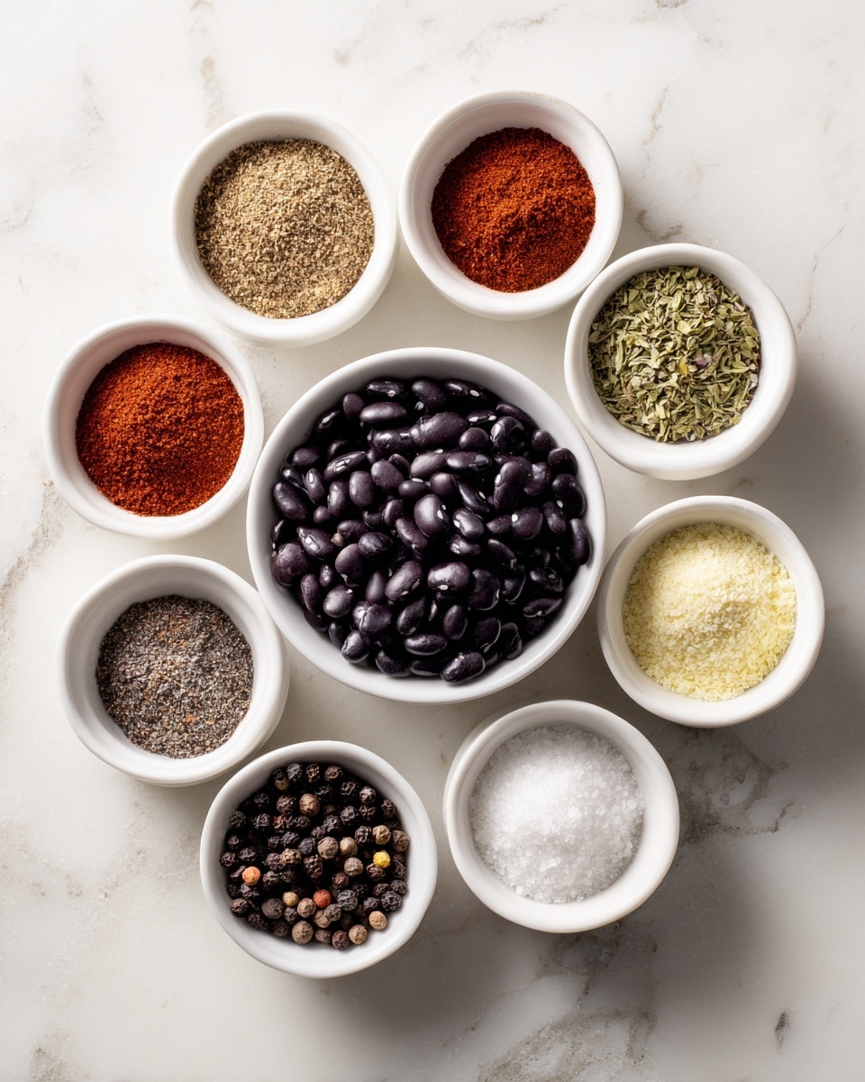 The image shows eight small white bowls arranged on a white marbled surface. In the center is a bowl filled with shiny black beans, dark purple to black in color with a smooth texture. Surrounding it in a loose circle are seven other bowls, each containing a different spice or seasoning. From the top and moving clockwise: a bowl with reddish-brown chili powder that has a fine texture, a bowl with light brown cumin powder that looks slightly grainy, a bowl with green dried oregano flakes, a bowl with pale yellow onion powder that is finely ground, a bowl with fine white salt, a bowl with crushed black pepper showing coarse black and brown bits, and a bowl with off-white garlic powder that looks powdery and soft. Each bowl is neatly filled and evenly spaced, viewed from above in bright light. Photo taken with an iphone --ar 4:5 --v 7