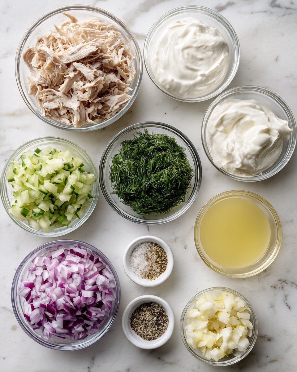 The image shows nine clear glass bowls arranged on a white marbled surface, each containing a different ingredient. Starting from the top left, a bowl holds shredded cooked chicken with light brown and white tones. Next to it is a bowl with thick white Greek yogurt. To the right, a small bowl contains pale yellow lemon juice. Below the lemon juice is a bowl with finely chopped dark green dill. Underneath the chicken bowl, a bowl is filled with green grated cucumber. Next to it, a bowl contains finely chopped red onion with purple and white pieces. Below the Greek yogurt, a small bowl has mixed seasonings in white and black colors. Finally, right of the seasonings is a small bowl of finely chopped garlic, pale yellow in color. All bowls are arranged neatly with their contents clearly visible, photo taken with an iphone --ar 4:5 --v 7
