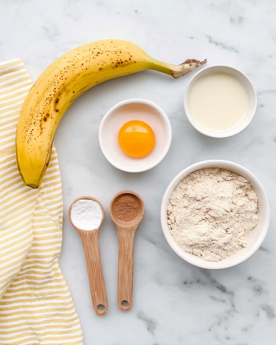 The image shows ingredients arranged on a white marbled surface, including a yellow banana with some brown spots positioned at the bottom left above a striped yellow and white cloth. Above and to the right of the banana, there is a white bowl filled with a light beige powder with some clumps. Next to it on the top right, there is a smaller white bowl containing a light cream liquid. On the top middle left, there is another small white bowl holding a raw egg with a bright orange yolk. Two wooden measuring spoons lie horizontally on the left side; the top one holds a white powder, while the bottom one holds a brown powder, both evenly filled. photo taken with an iphone --ar 4:5 --v 7