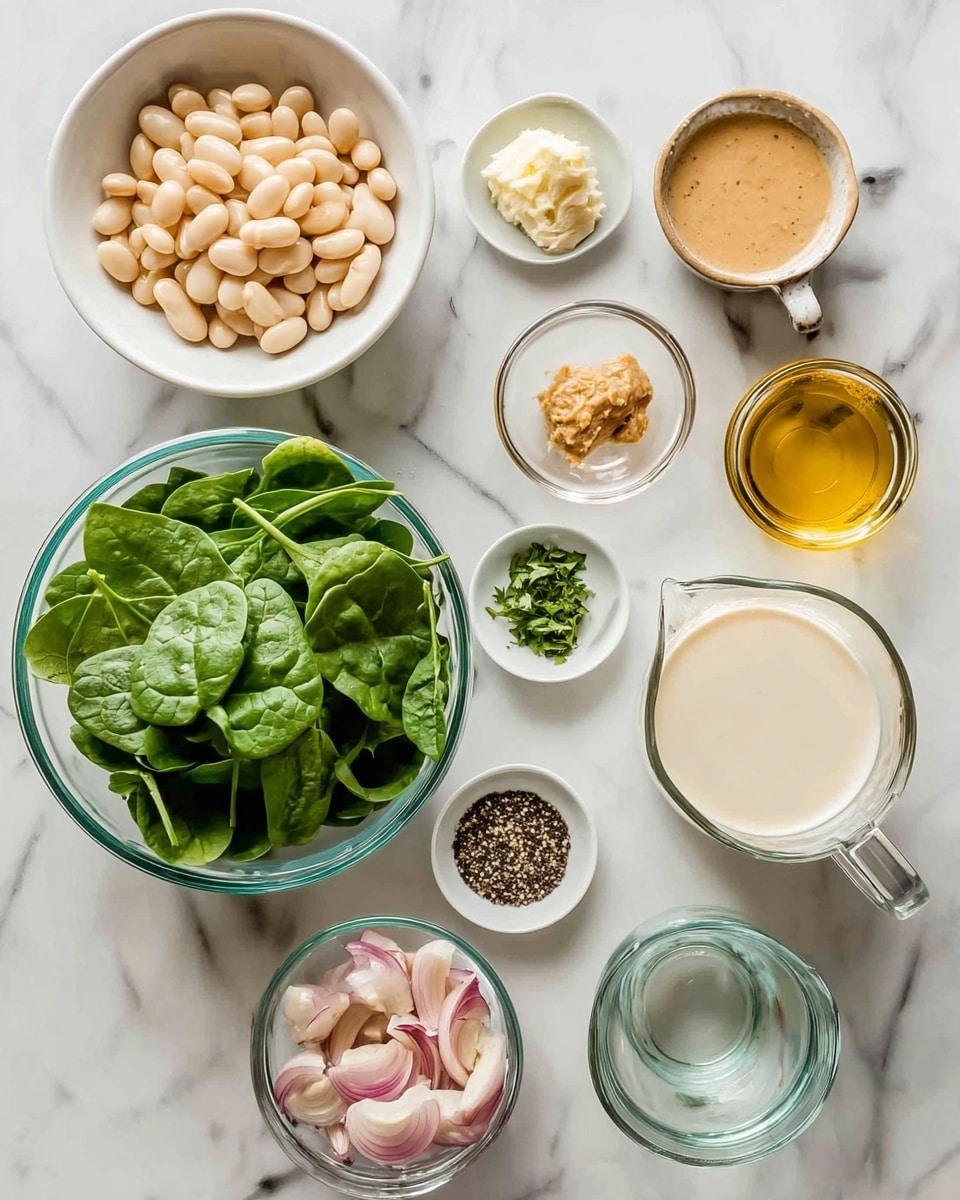 The image shows an overhead view of multiple clear glass bowls and small glass containers on a white marbled surface. In the bottom left, there is a large bowl filled with fresh green spinach leaves. To the right of it, a measuring cup holds a creamy white liquid. Above that, a small glass bowl contains minced garlic. Nearby, there is a small pile of light brown paste in another small bowl. A tiny bowl with finely chopped green herbs and a small container with golden olive oil are close together. To the upper left, a large white bowl is filled with large, pale beige beans. Next to the beans is a small bowl containing sliced shallots with a soft pink and white color. Above the beans, a large measuring cup holds a clear light brown liquid. Peanut-sized piles of black pepper and salt are also present in a small clear bowl near the middle of the layout. Each item is neatly arranged, keeping a balanced spacing against the white marbled surface. photo taken with an iphone --ar 4:5 --v 7