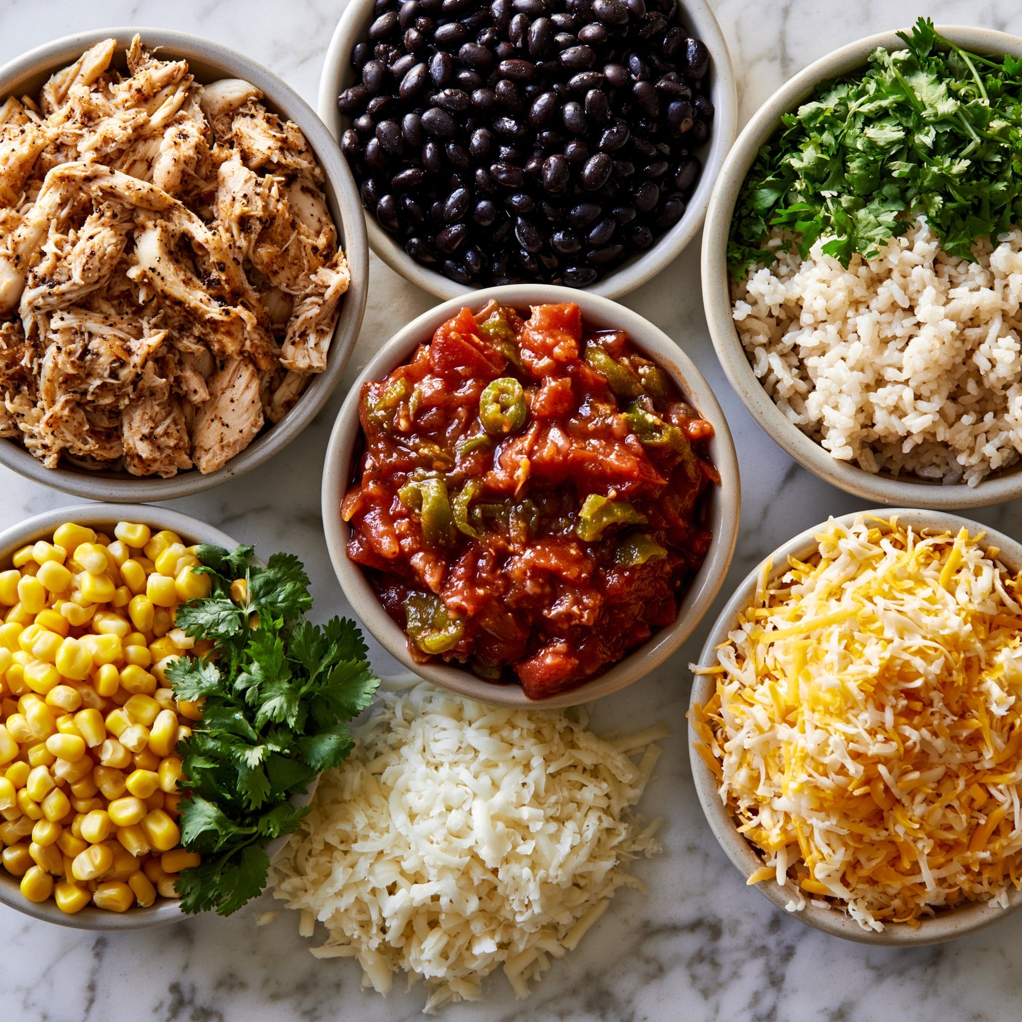 A black oval casserole dish holds a layered rice dish topped with melted cheese and garnished with small green cilantro leaves. The top layer is a golden mix of melted cheese, yellow corn kernels, and bits of red pepper, all resting on a thick bed of seasoned rice mixed with shredded chicken. The rice is orange-red in color and looks moist with visible strands of meat throughout. The casserole is placed on a white marbled surface, with a cloth napkin and some fresh green herbs nearby. The image includes a woman's hand holding a serving spoon scooping out a portion from the dish. Photo taken with an iphone --ar 4:5 --v 7